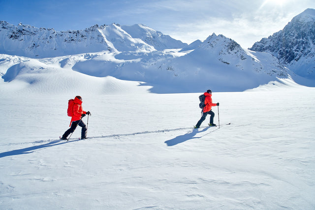 two people snow walking with Alpha Parka